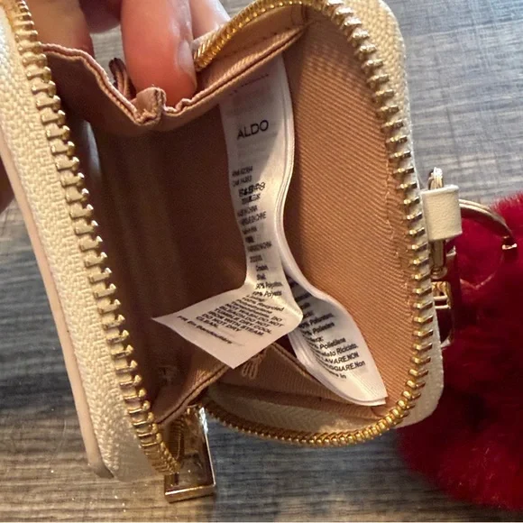 Aldo Cream Zip-Around Card & Key Holder with Burgundy Pom Charm - Picture 2 of 3